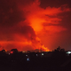 This general view taken on May 22, 2021 in Goma in the east of the Democratic Republic of Congo shows flame spewing from the Nyiragongo volcano.